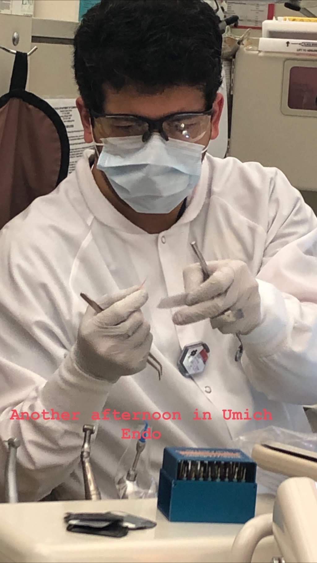 Dr. Sahil Manhas working with dental instruments in a clinical setting
